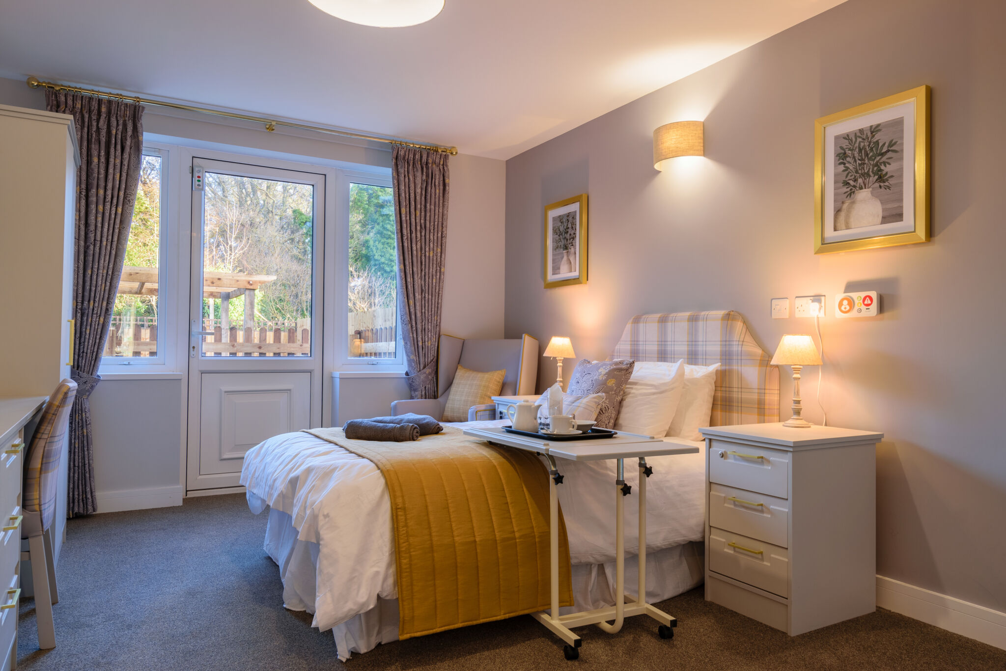A beautiful bedroom looking out into the garden at St Mary's Riverside